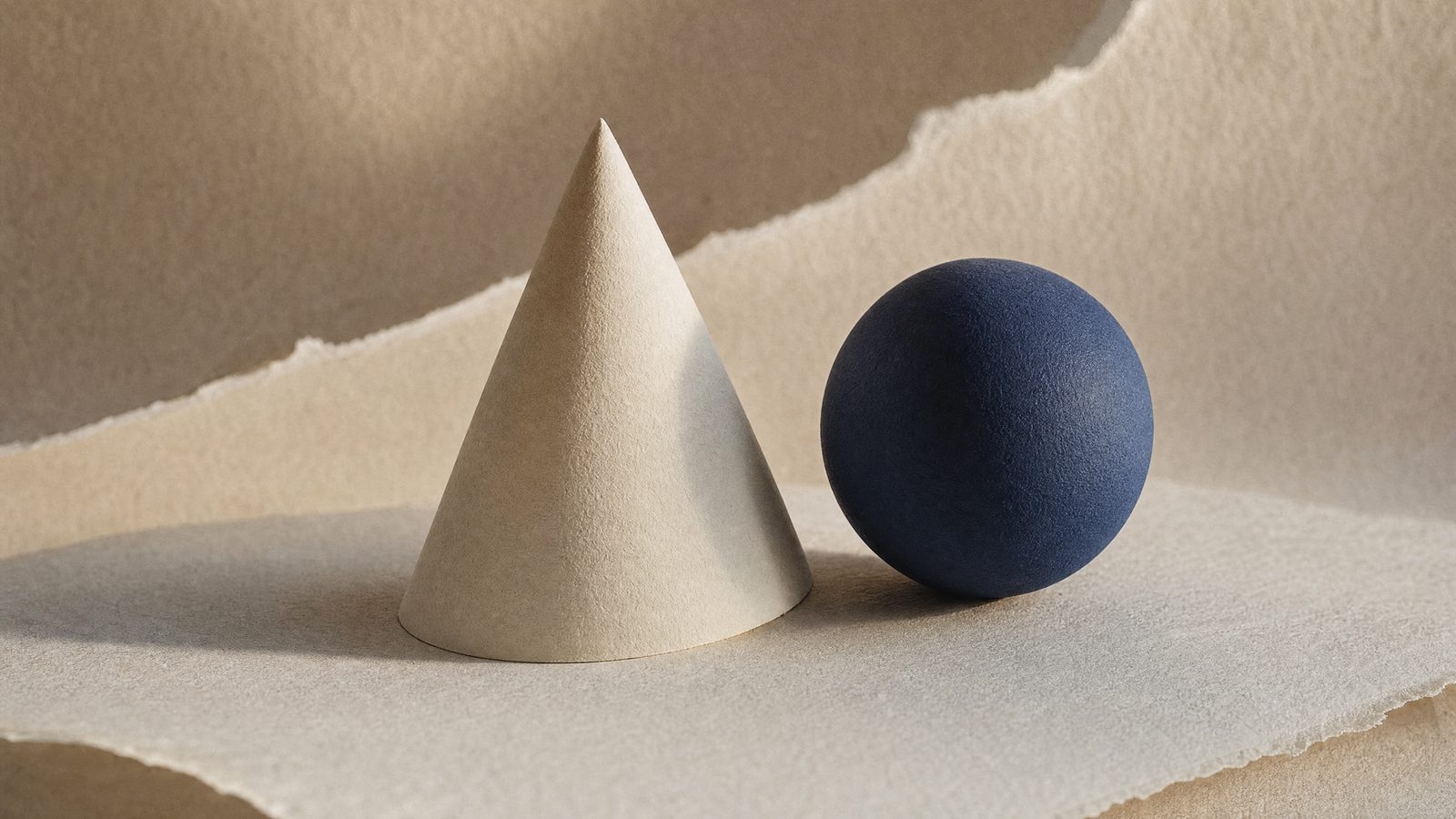 A paper cone beside a navy sphere, an abstract for what an AI marketing agency is